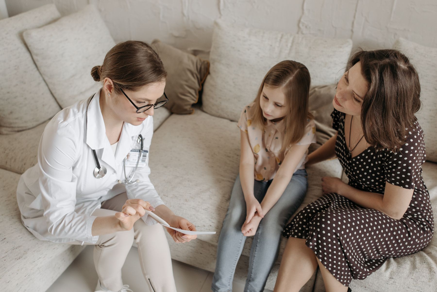 A clinician having a warm, attentive conversation with a patient